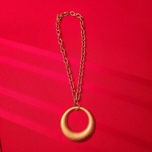 Gold tone round pendant necklace